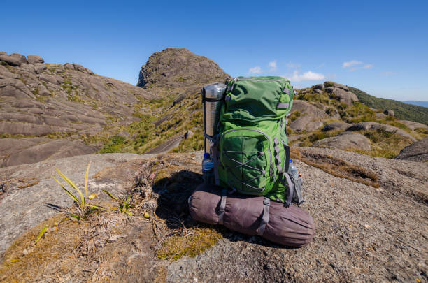 Backpack in mountain landscape background. itaguaré peak, brazil.