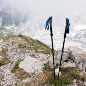 Hiking poles on top of a mountain hiking equipment