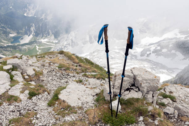 Hiking poles on top of a mountain hiking equipment